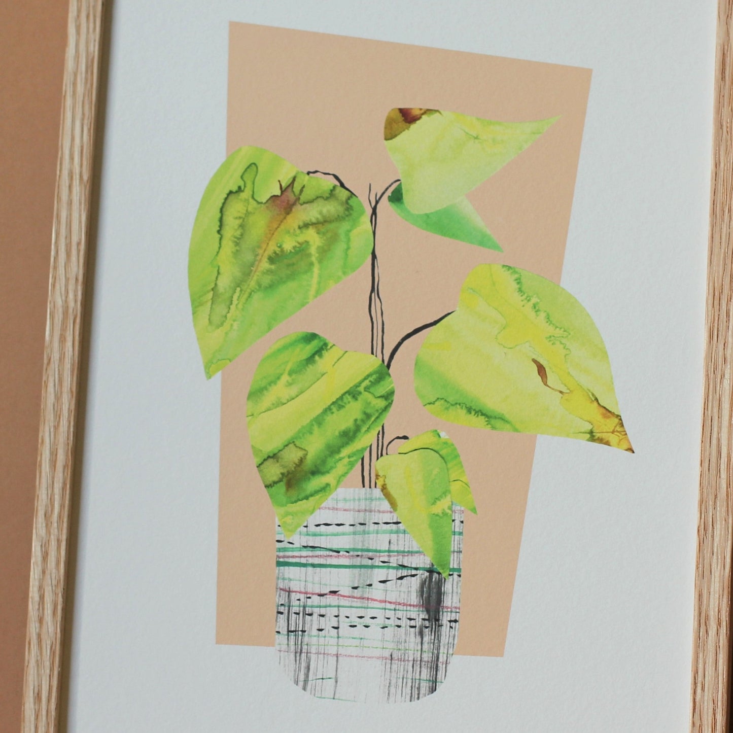 A detail of a houseplant art print. The detail shows that the leaves are made from collaged hand painted watercolours.