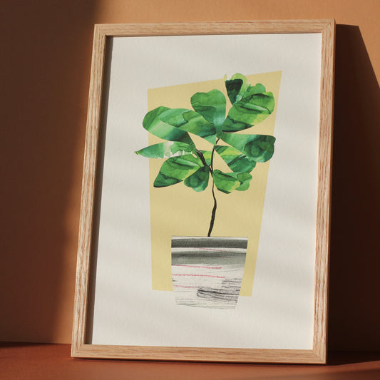 A houseplant art print of a fiddle leaf fig plant in a midcentury style planter. The original artwork was created using collaged watercolour papers.